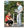Two students preparing the NewtonCar for a test run. by APPLIED PHYSICS LLC